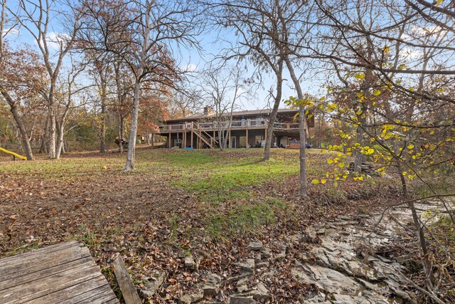 back of property featuring a wooden deck