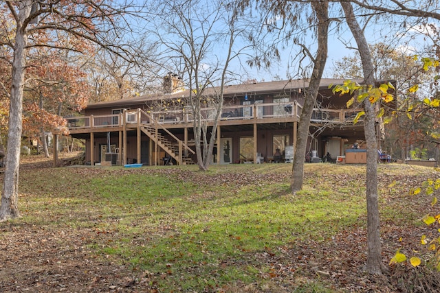 rear view of house with a wooden deck