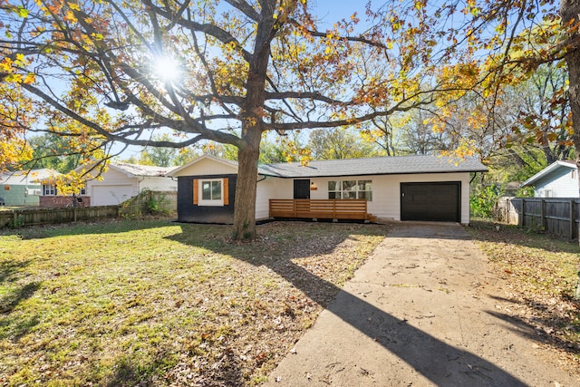 single story home featuring a front lawn and a deck