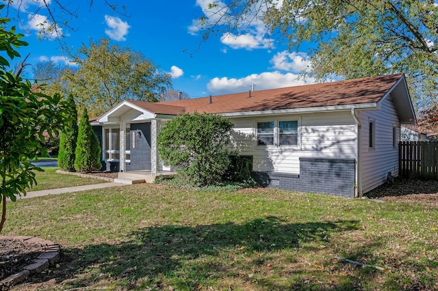 ranch-style home with a front yard