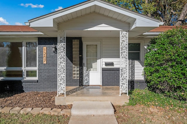 doorway to property with a porch