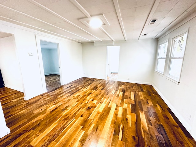 empty room featuring hardwood / wood-style flooring