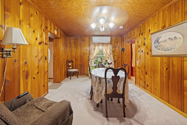 dining area featuring ceiling fan, a wall unit AC, light carpet, and wooden walls