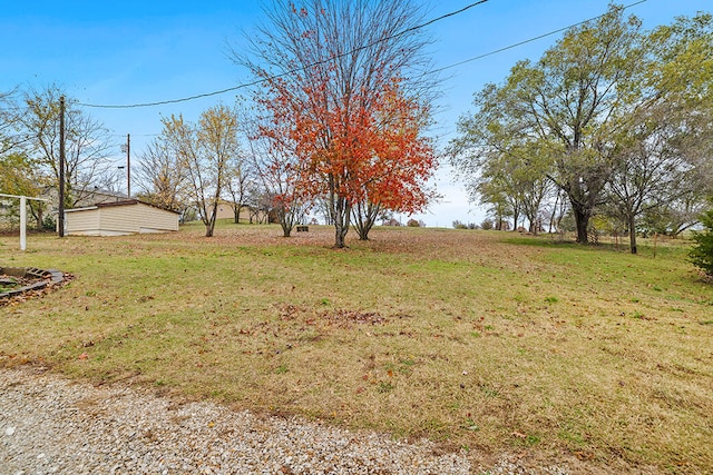 view of yard with a rural view