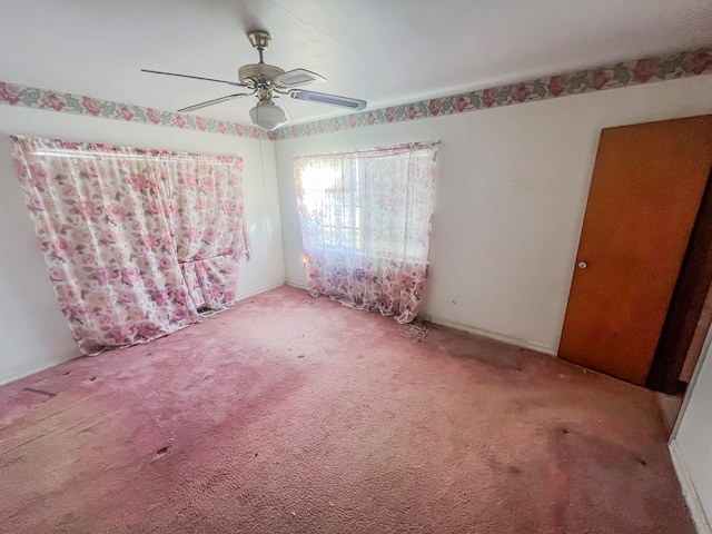 unfurnished bedroom with carpet and ceiling fan