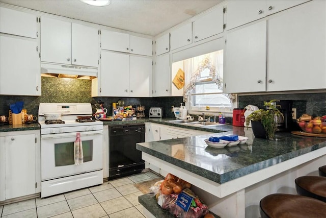 kitchen featuring dishwasher, white gas range oven, white cabinets, and sink