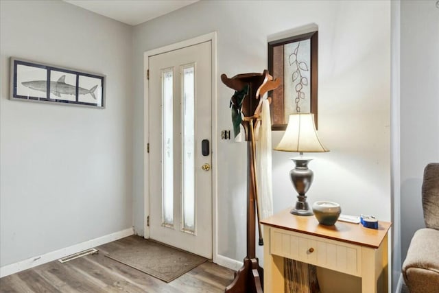 entryway with hardwood / wood-style floors