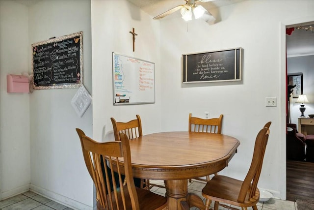 dining room with hardwood / wood-style floors and ceiling fan