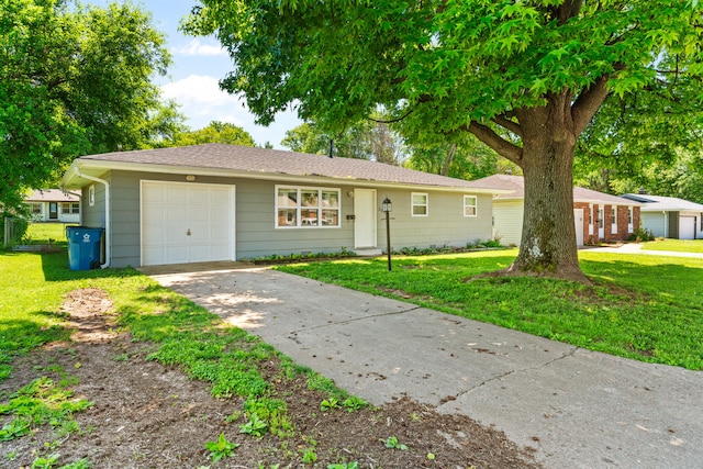 ranch-style home with a garage and a front lawn