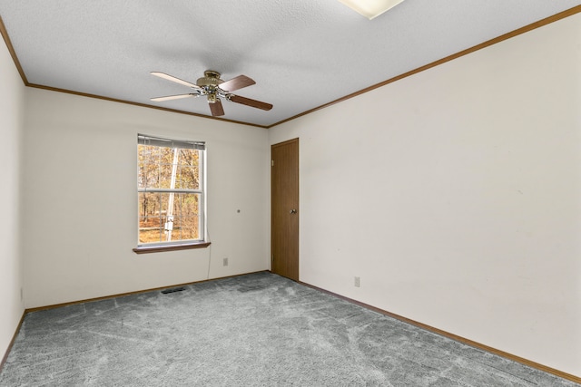 unfurnished room featuring carpet flooring, ceiling fan, ornamental molding, and a textured ceiling