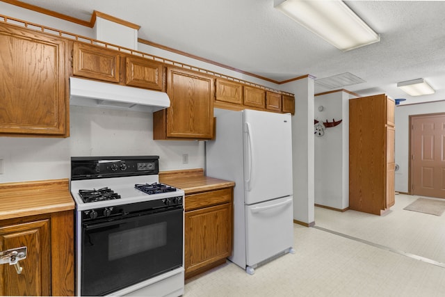 kitchen with a textured ceiling, white appliances, and crown molding