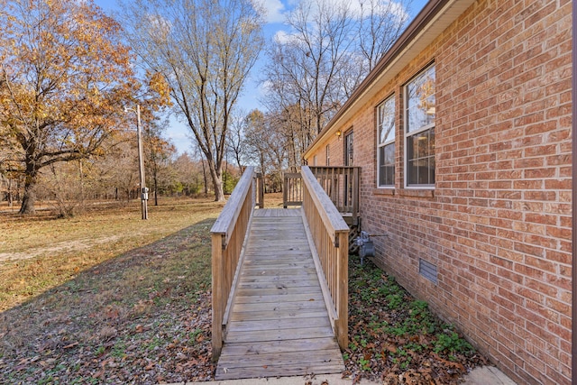 exterior space with a lawn and a deck