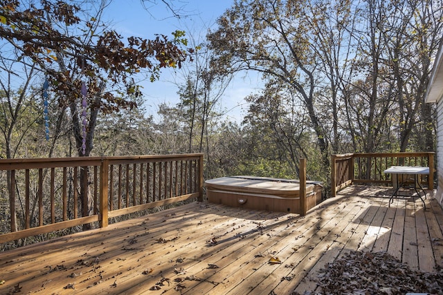 wooden terrace featuring a covered hot tub