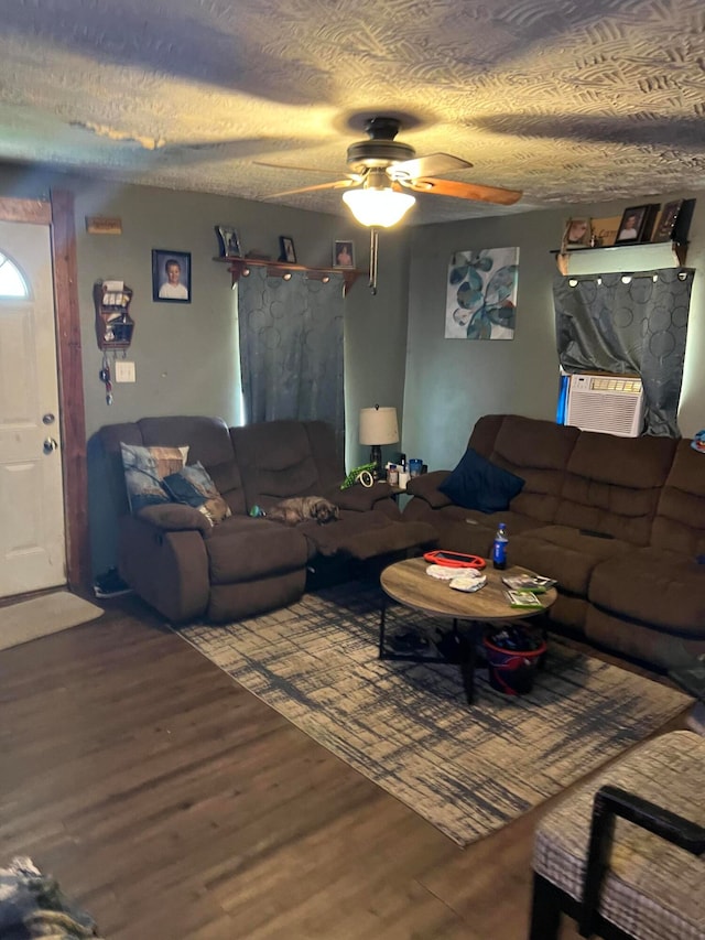 living room with hardwood / wood-style flooring, ceiling fan, and cooling unit