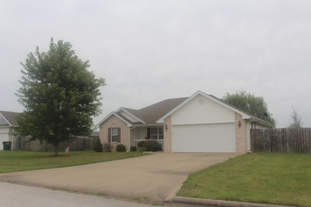 ranch-style home with a front yard and a garage