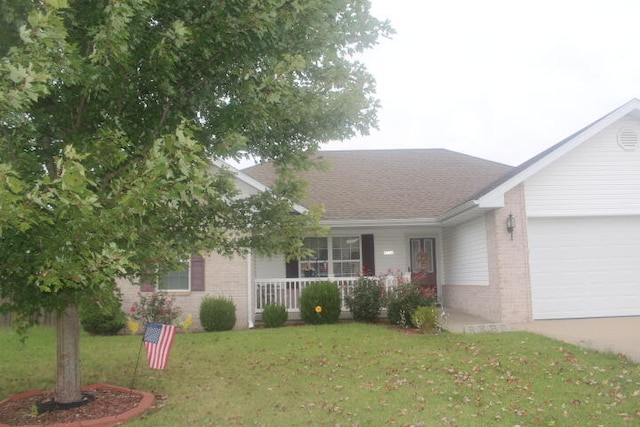 ranch-style house with a front yard, a porch, and a garage