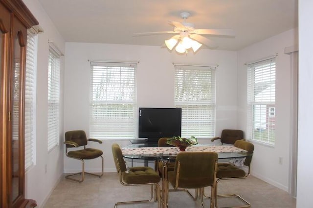 interior space with ceiling fan