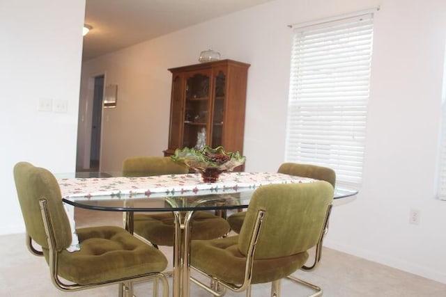 view of carpeted dining space