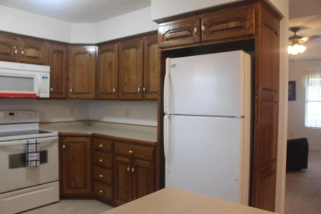 kitchen with ceiling fan and white appliances