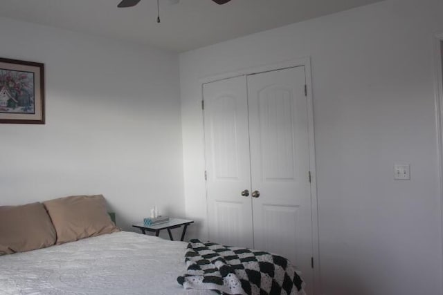 bedroom with ceiling fan and a closet