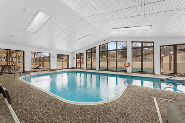 view of pool featuring a skylight