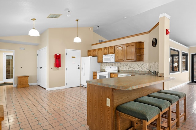 kitchen with high vaulted ceiling, kitchen peninsula, decorative light fixtures, white appliances, and decorative backsplash