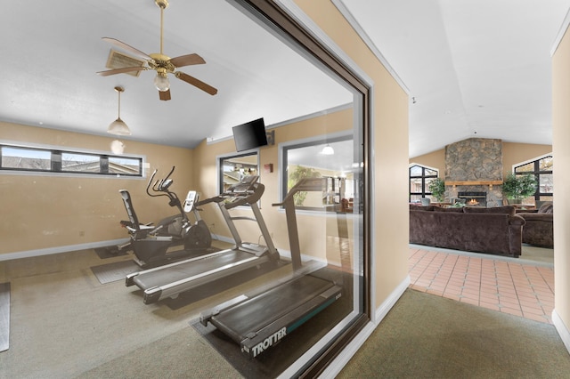 exercise room featuring ceiling fan, lofted ceiling, a fireplace, and carpet floors