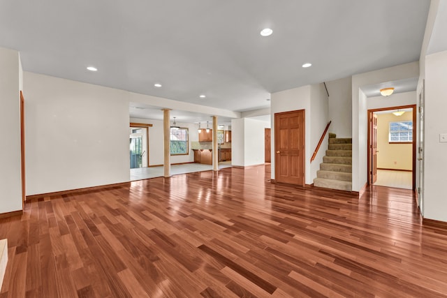 unfurnished living room with hardwood / wood-style flooring