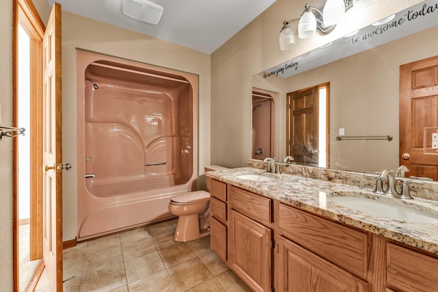 full bathroom with tile patterned floors, vanity, bathing tub / shower combination, and toilet