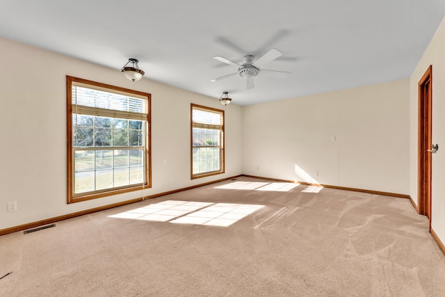 unfurnished bedroom with ceiling fan and light colored carpet