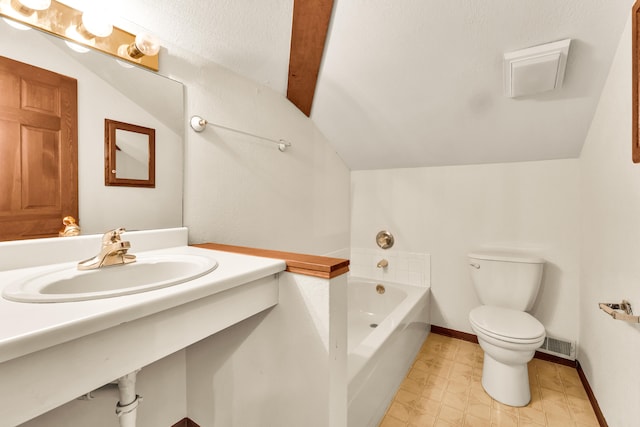 bathroom featuring toilet, a bath, vaulted ceiling, and sink