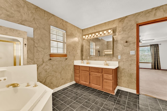 bathroom with tile patterned flooring, vanity, a wealth of natural light, and ceiling fan