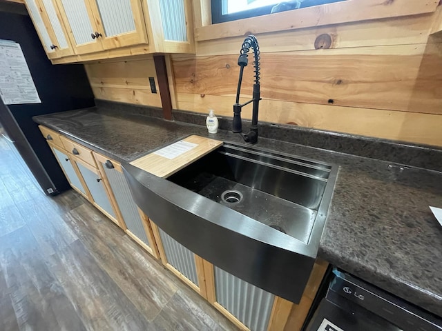 kitchen with dishwasher, light brown cabinets, sink, and dark wood-type flooring