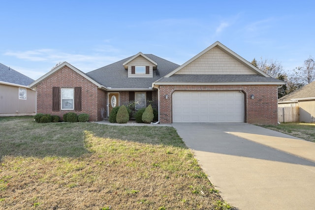 view of front facade with a garage and a front yard