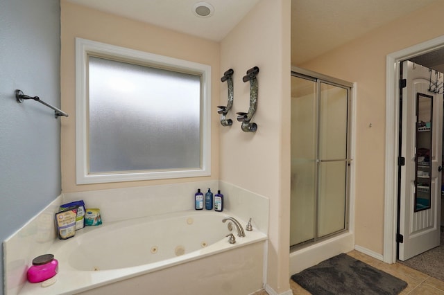 bathroom featuring tile patterned flooring and plus walk in shower