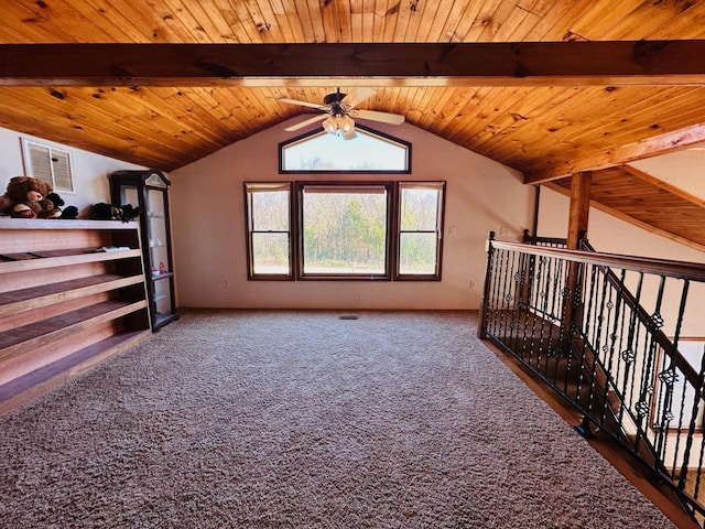 bonus room with lofted ceiling with beams, dark carpet, ceiling fan, and wood ceiling