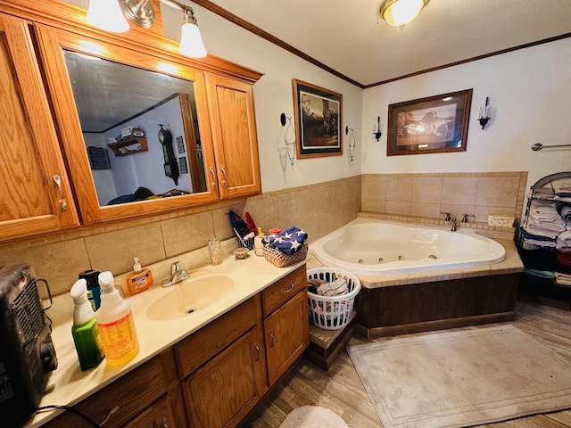 bathroom with a tub, crown molding, vanity, and wood-type flooring