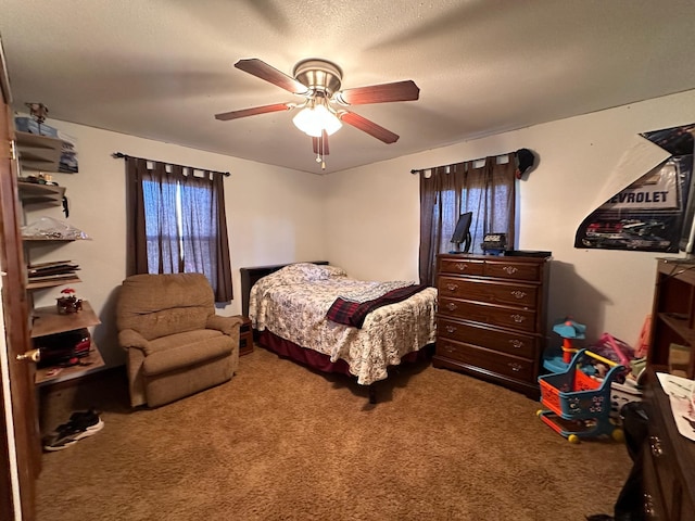 carpeted bedroom with a textured ceiling and ceiling fan