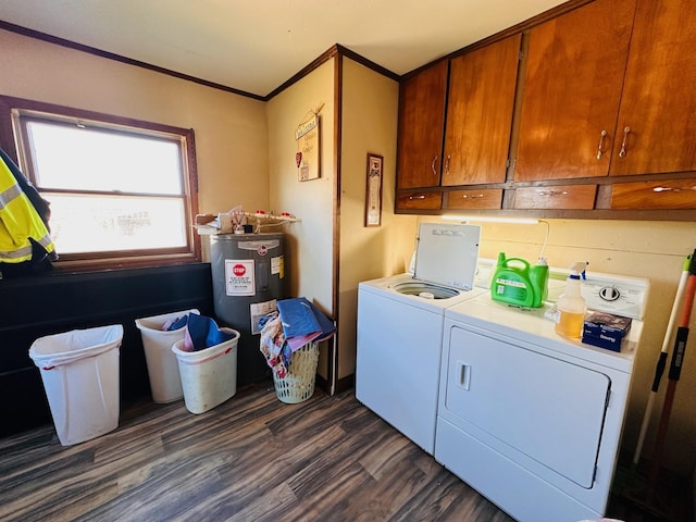 laundry room featuring cabinets, electric water heater, dark hardwood / wood-style flooring, crown molding, and washer and clothes dryer