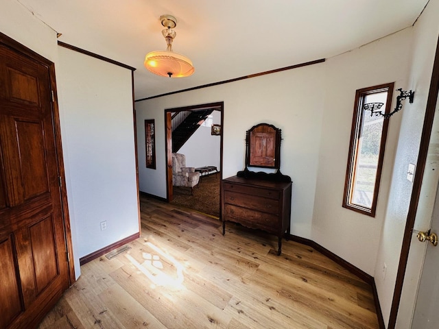 hall with light wood-type flooring