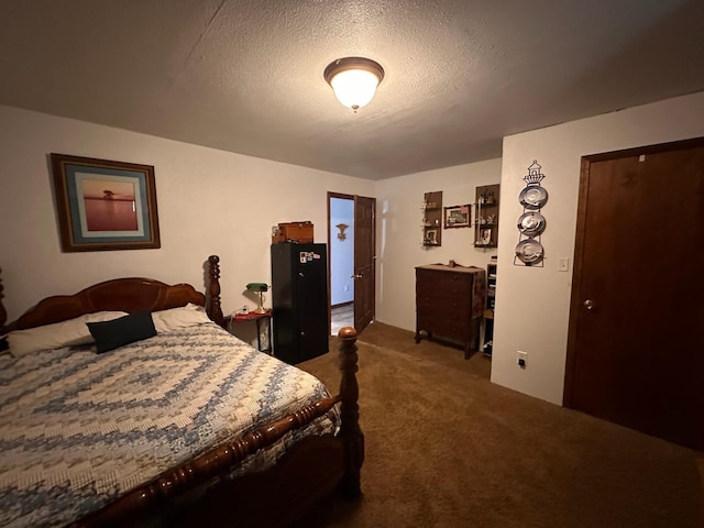 carpeted bedroom with a textured ceiling