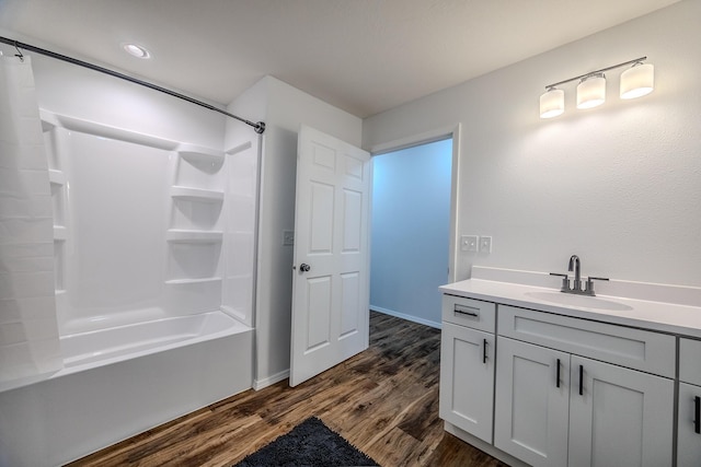 538 W Mack Rd, Seymour, MO 65746 - bathroom with wood finished floors, shower / tub combo with curtain, vanity, and baseboards