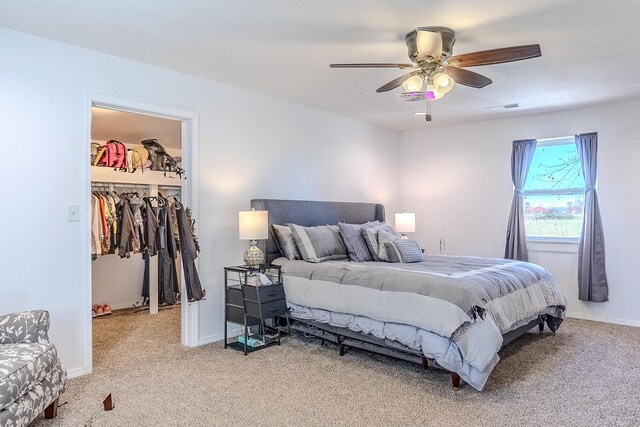538 W Mack Rd, Seymour, MO 65746 - bedroom featuring light colored carpet, a walk in closet, a ceiling fan, baseboards, and a closet