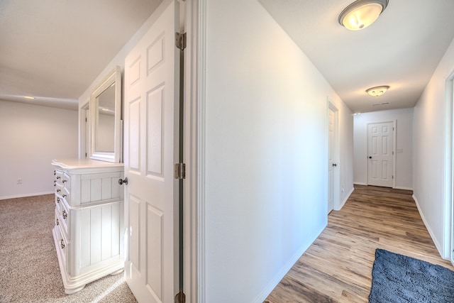 corridor featuring light hardwood / wood-style flooring