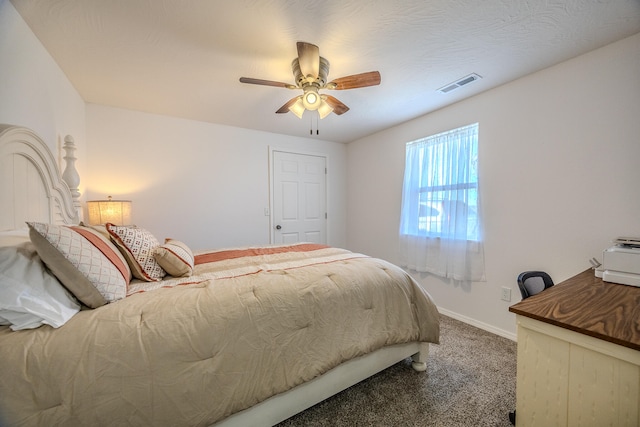 bedroom featuring ceiling fan and carpet