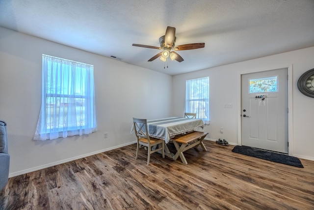 538 W Mack Rd, Seymour, MO 65746 - dining room featuring wood finished floors, ceiling fan, and baseboards