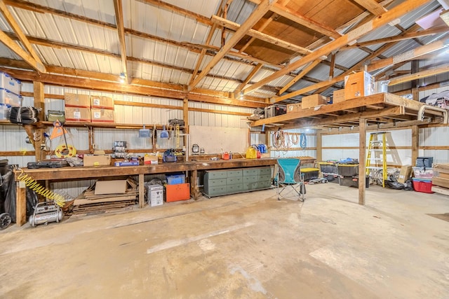 538 W Mack Rd, Seymour, MO 65746 - garage featuring a workshop area and metal wall