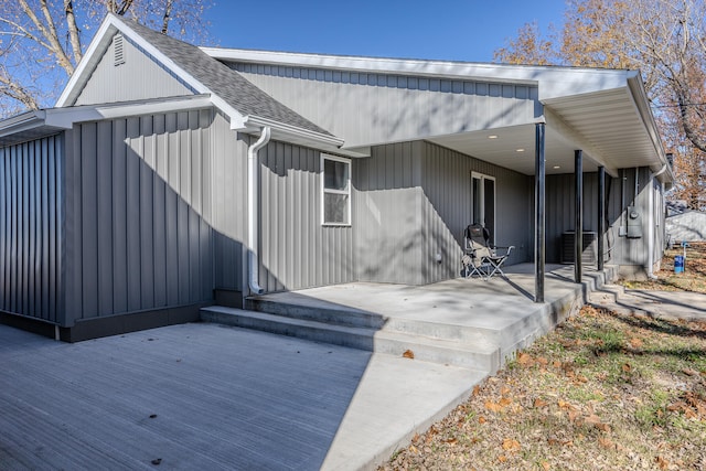 rear view of property with covered porch