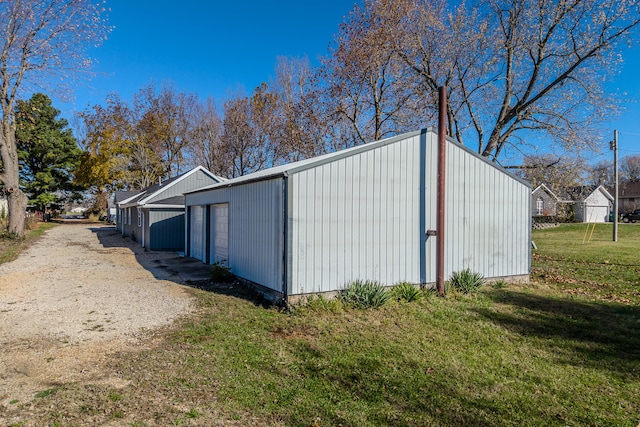 view of outbuilding with a lawn