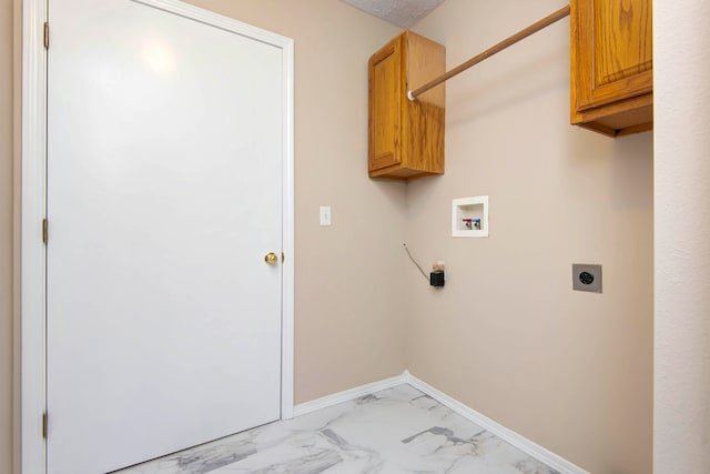 clothes washing area featuring washer hookup, hookup for an electric dryer, and cabinets